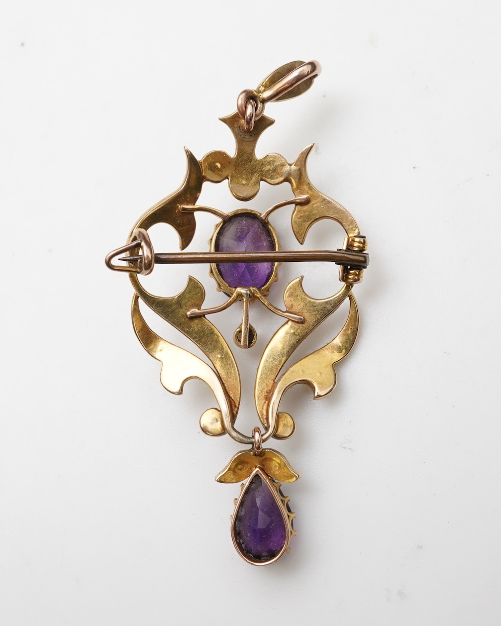 An Edwardian amethyst and seed pearl pendant and bar brooch, early 20th century